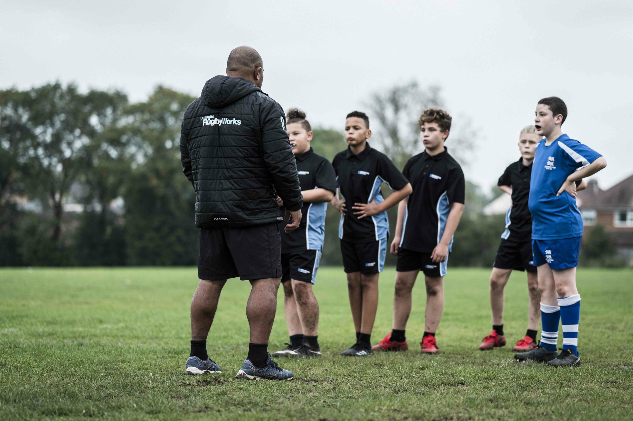 Rugby coach with young people