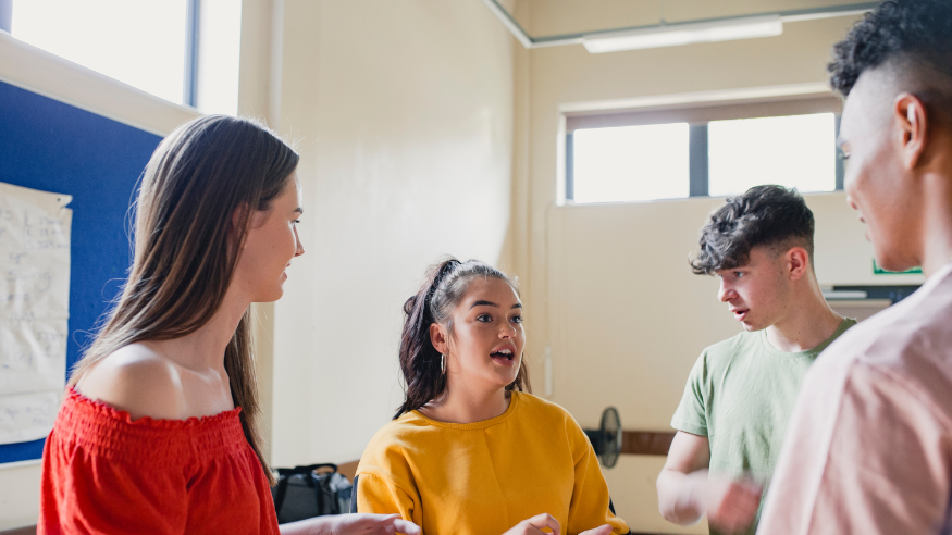 Teenagers talking in a youth club.